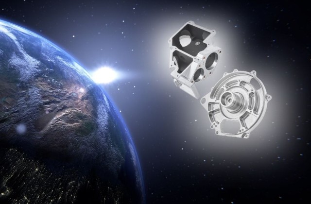 Technische Bauteile der mechanischen Fertigungstechnik schweben im Weltall nebne einer Erdkugel hinter der ein helles Licht leuchtet